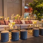 Cozy and stylish indoor lounge featuring plush seating, floral arrangements, and candlelit ambiance. — Transform Your Home wi