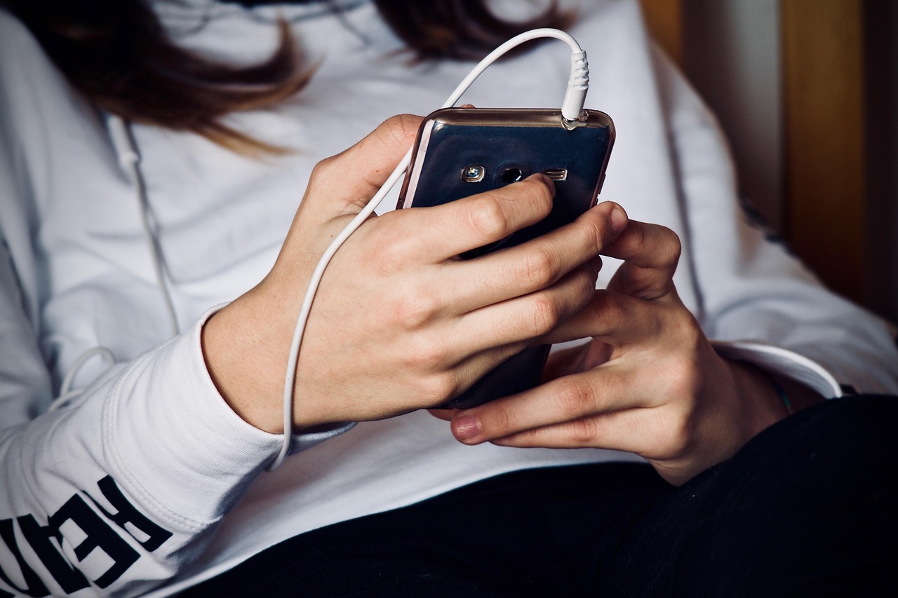 Woman, mobile phone, listening to music — Union Square Residences Featuring Lifestyle-Enhancing Amenities